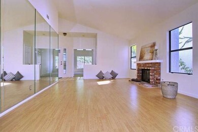 Spacious Living/Dining area with fireplace and woo