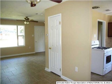 View of breakfast area to living room and kitchen