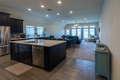 Beautiful layout with the kitchen opening to the dining area and on to the living room.