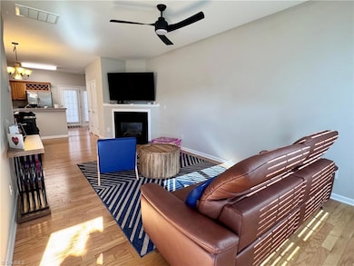 Entry view of living room with gas logs