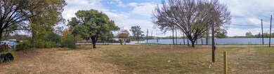 View of yard with a water view