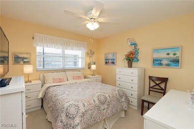 Bedroom featuring light colored carpet and ceiling fan