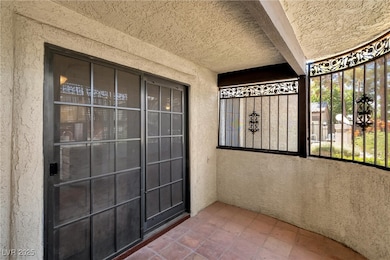 Doorway to property with stucco siding