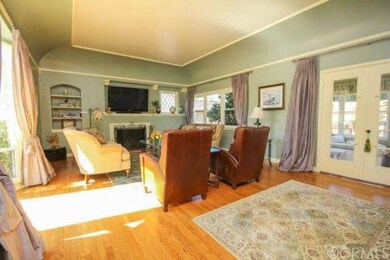 Living room with high ceiling, bay window, decorat