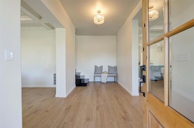 Hall featuring light wood-type flooring