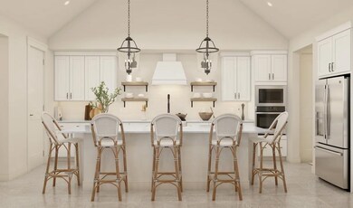 Kitchen with sloped ceiling and pendant lighting