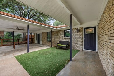 View of exterior entry with brick siding, a ceili