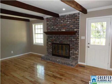 Living room with brick fireplace