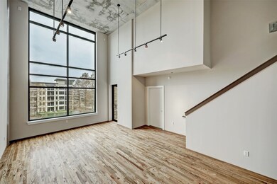 This fantastic room affords many possibilities for furniture placement.  The entrance to the balcony is just to the right of the window and the Guest Bedroom is the door to the left of the stairway.