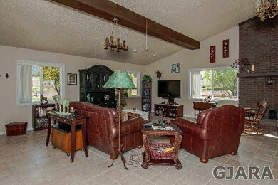 Enjoy the warmth of the fireplace in the large liv