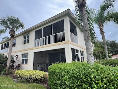 Back of property featuring enclosed lanai
