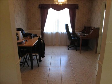 Tiled formal dining room with chair rail