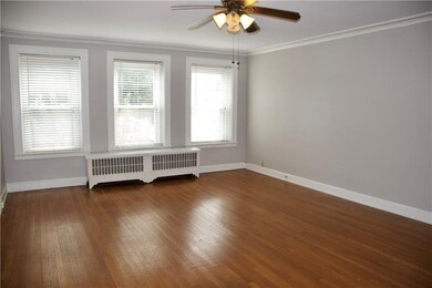 The spacious living area welcomes you with wall of