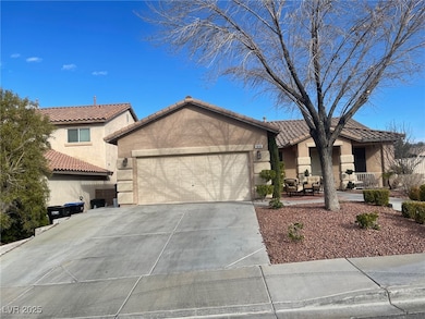 View of front of home featuring a garage, stucco s