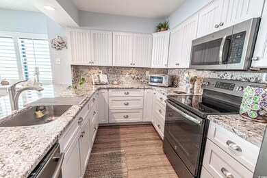 Kitchen with sink, tasteful backsplash, light hard