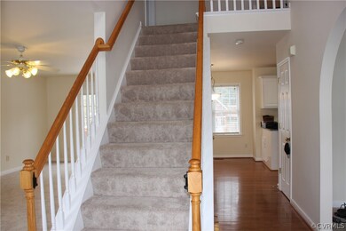 Foyer/ Entry leading to 2nd floor, kitchen ahead,