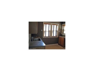 The kitchen with work area and shutters.