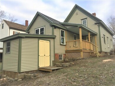 Exterior-small shed leads to basement.