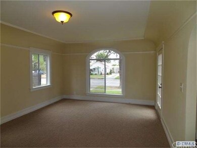Large living room with beautiful arched window