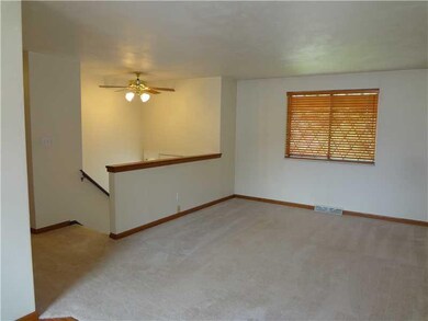 Living Room. Freshly cleaned carpeting and wooden 