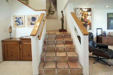 Rustic Spanish pavers in entrance foyer continue d