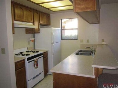The kitchen has solid surface counters and an eati