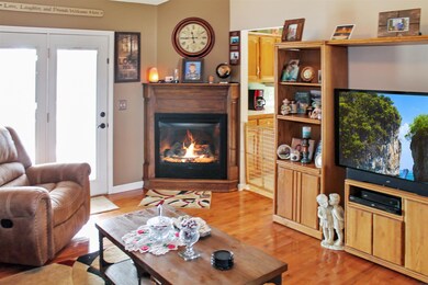 As you enter the home into the living room the fireplace gives this room a cozy 