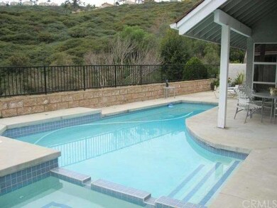 Heated pool and spa overlook the green hillsides. 