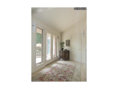 The foyer with marble floors welcomes you into the