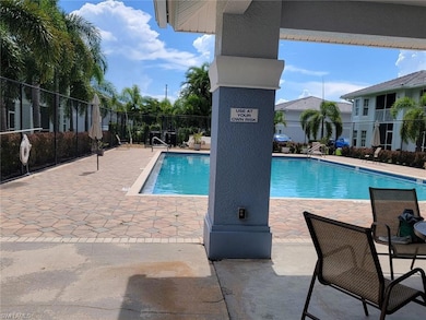 Community pool featuring a patio