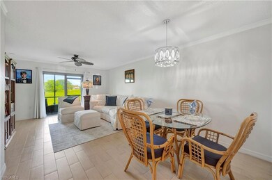 Dining space featuring crown molding, light hardwo
