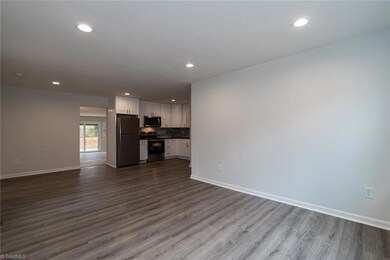 View from front door-Great Room.  Long wall will easily fit long sofa and end table.
