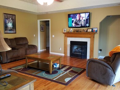 Cozy up to the fireplace in winter and bring in the big sectional sofa.