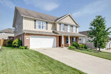 This green yard is feed by a sprinkler system to keep it green all year round.-Notice the covered front porch for those lazy Saturdays.