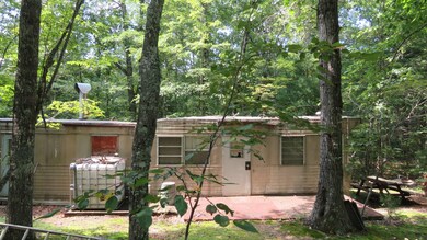 old singlewide used as hunt camp