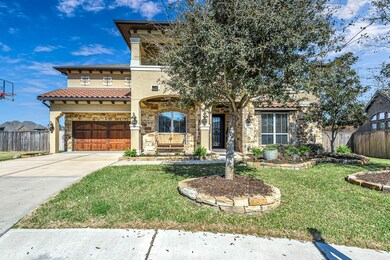 Very spacious 3-car garage with a rough cedar veneer garage door and an auto door opener