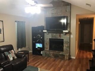 living room with fireplace down hall