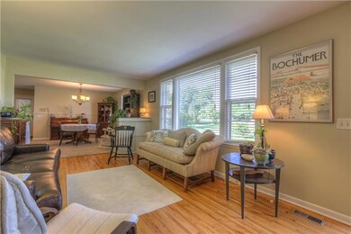 Front entry to Living Room with view of Dining Room.