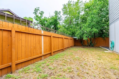 View of fenced backyard