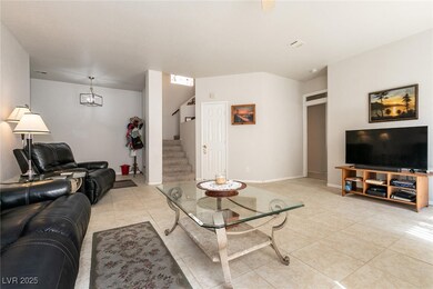 Living room featuring light tile patterned floors