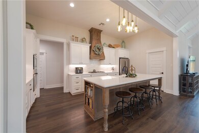 Kitchen featuring stainless steel appliances, dark