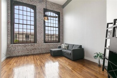 The living room is graced with massive windows on