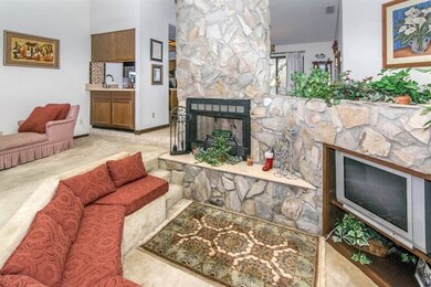 Stone-faced, two story wood burning fireplace with