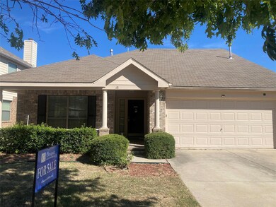Single story home with a front yard and a garage