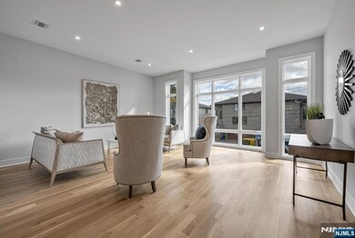 Formal living room with floor to ceiling windows