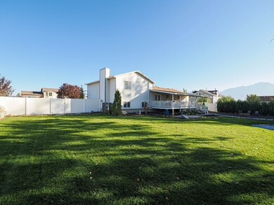 Rear view of property featuring a chimney