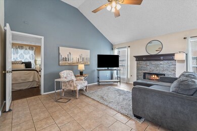 With its gas fireplace, vaulted ceilings, and stre