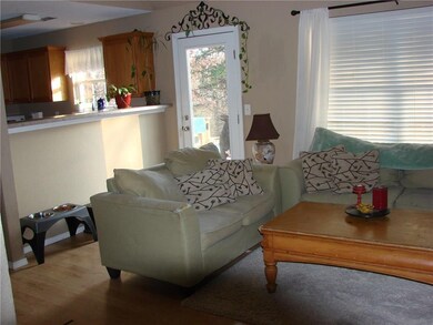 living room looking toward the kitchen and back door to the back yard