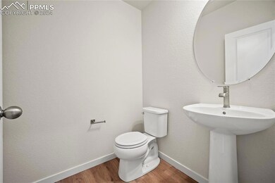 Bathroom featuring wood-type flooring and toilet