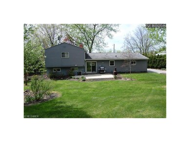 View of back of home with cement patio